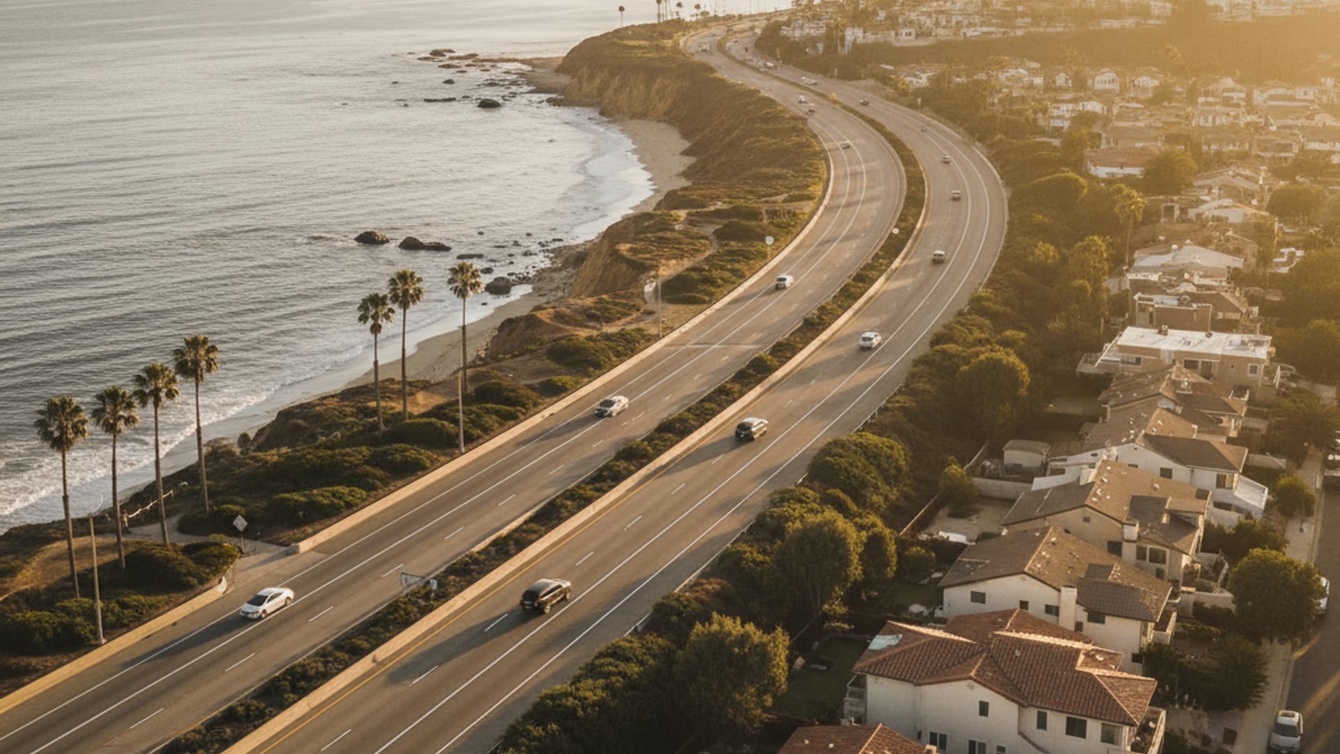 Aerial view of the Inland Empire freeway network at golden hour showing Fontana through Riverside to Victorville